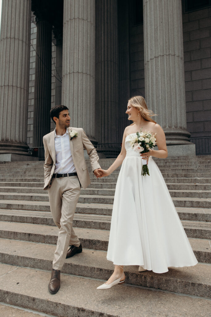 NYC elopement photographer photographing the couple at NYC City Hall
