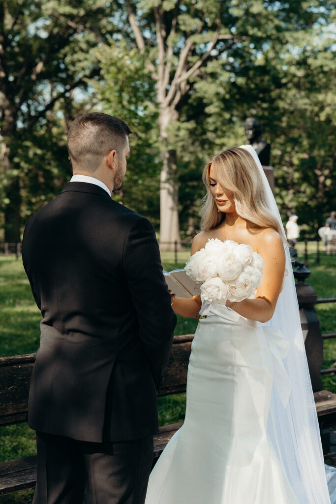 NYC bride and groom exchange vows during their Central Park elopement ceremony.