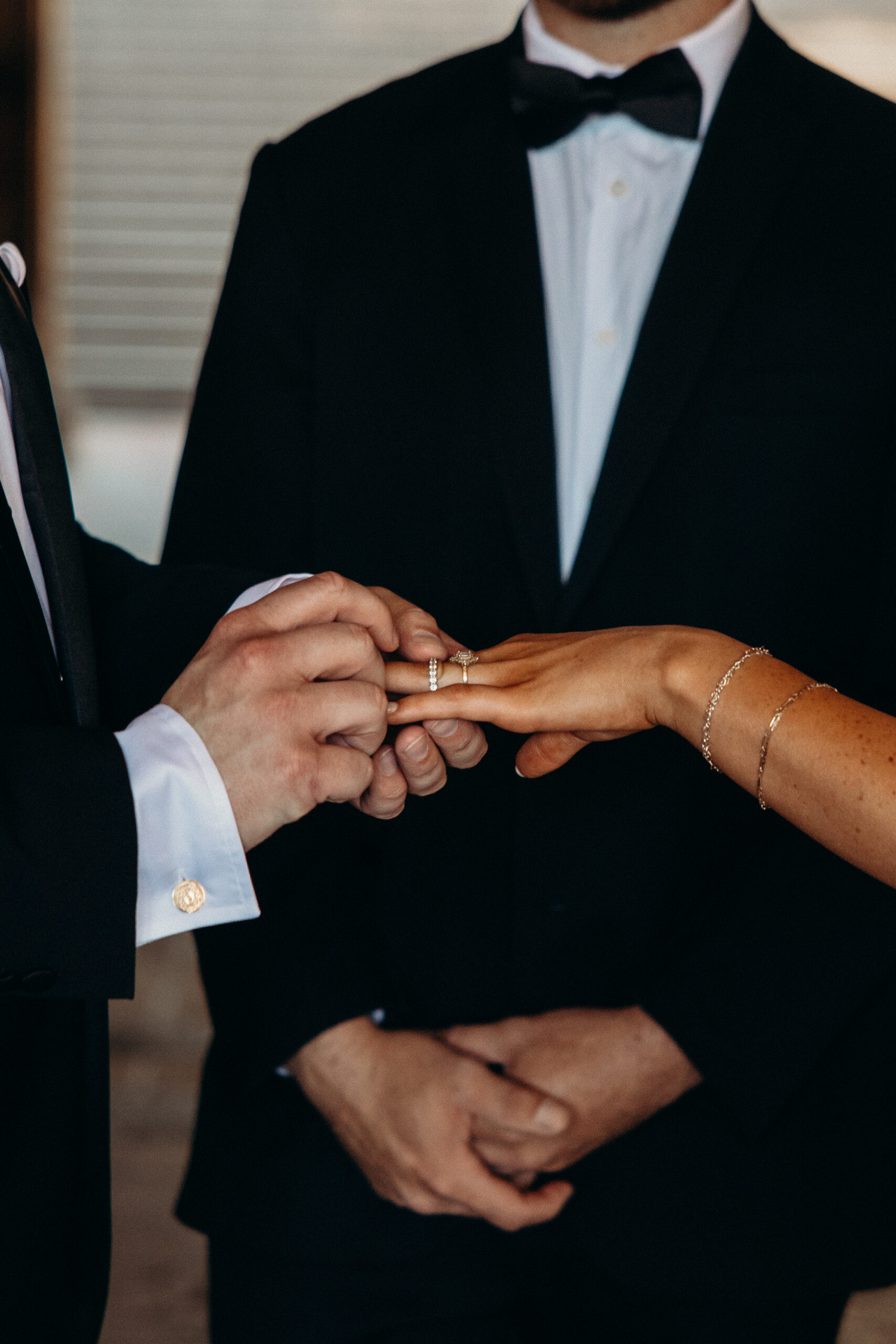 NYC bride and groom exchange rings during their Central Park elopement ceremony.