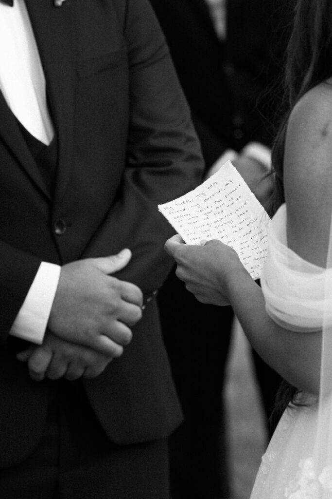 Bride shares vows during wedding ceremony at Stonewall Estate