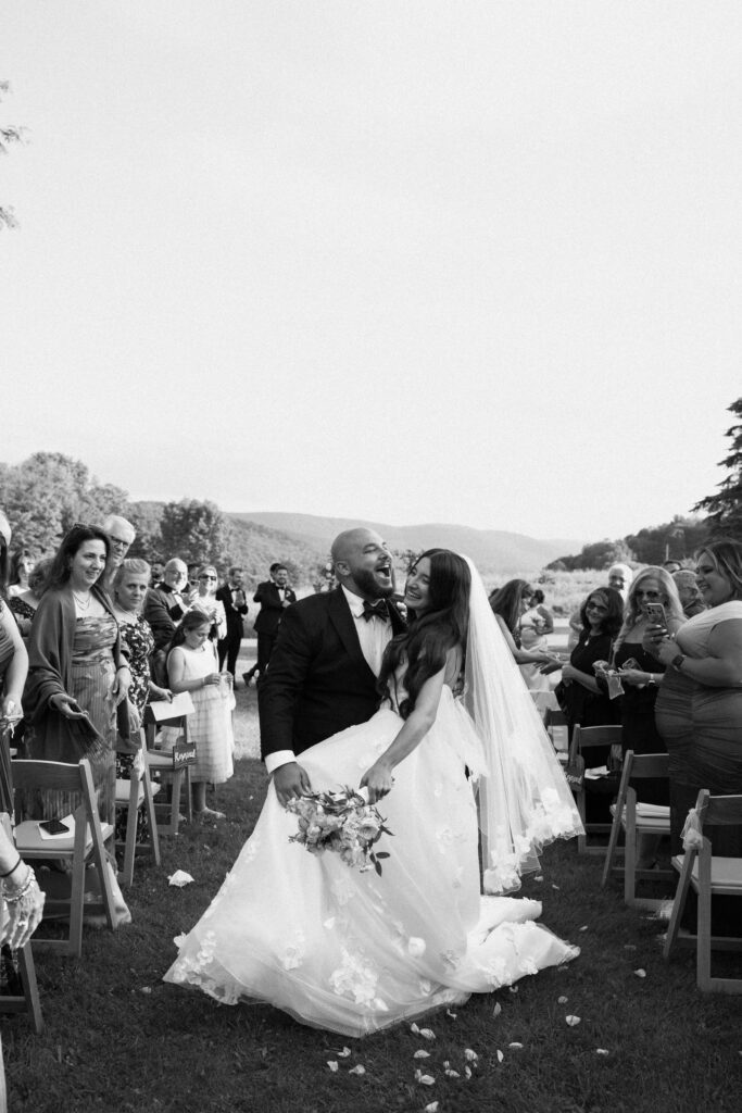 Bride and groom walk down the aisle at Stonewall Estate