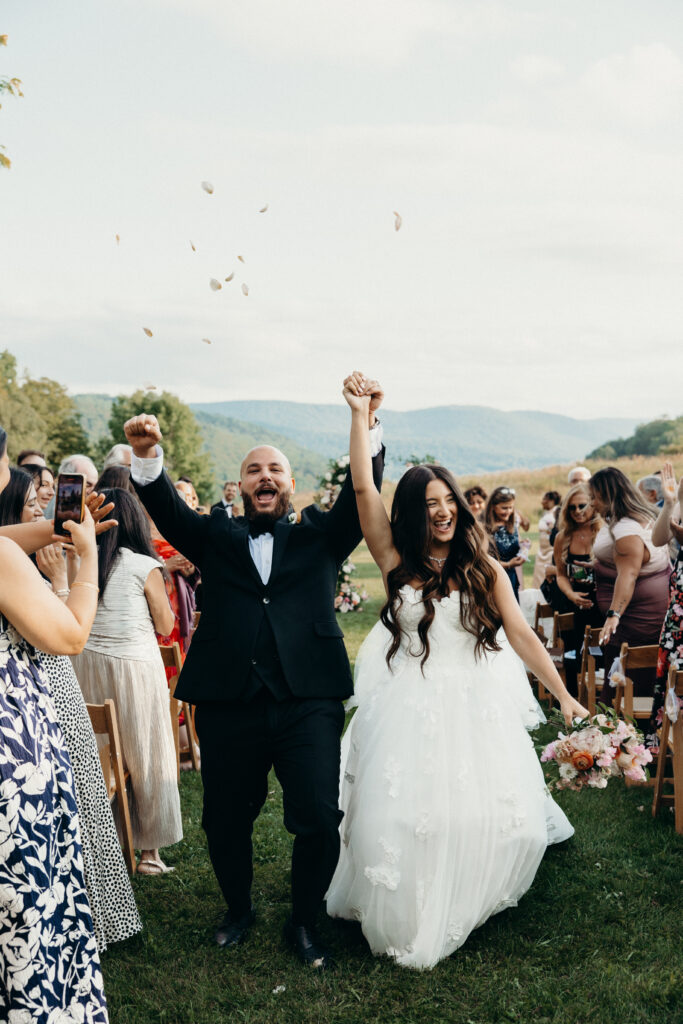 Bride and groom walk down the aisle at Stonewall Estate