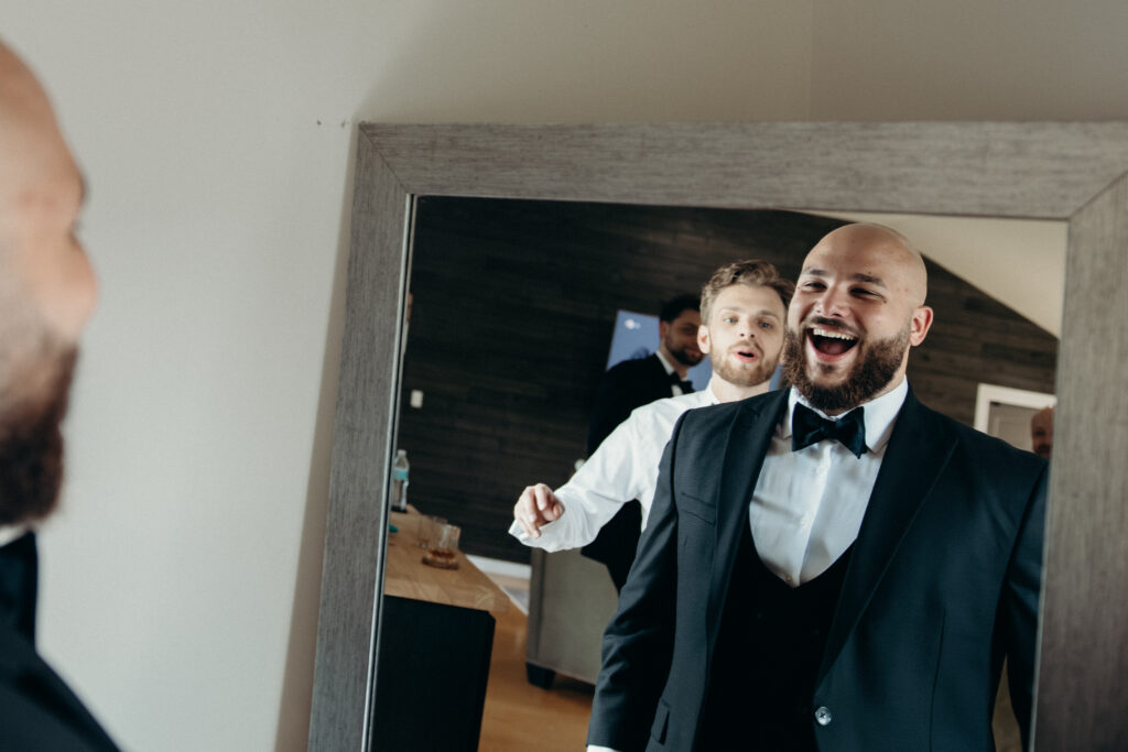Groom getting ready at Stonewall Estate