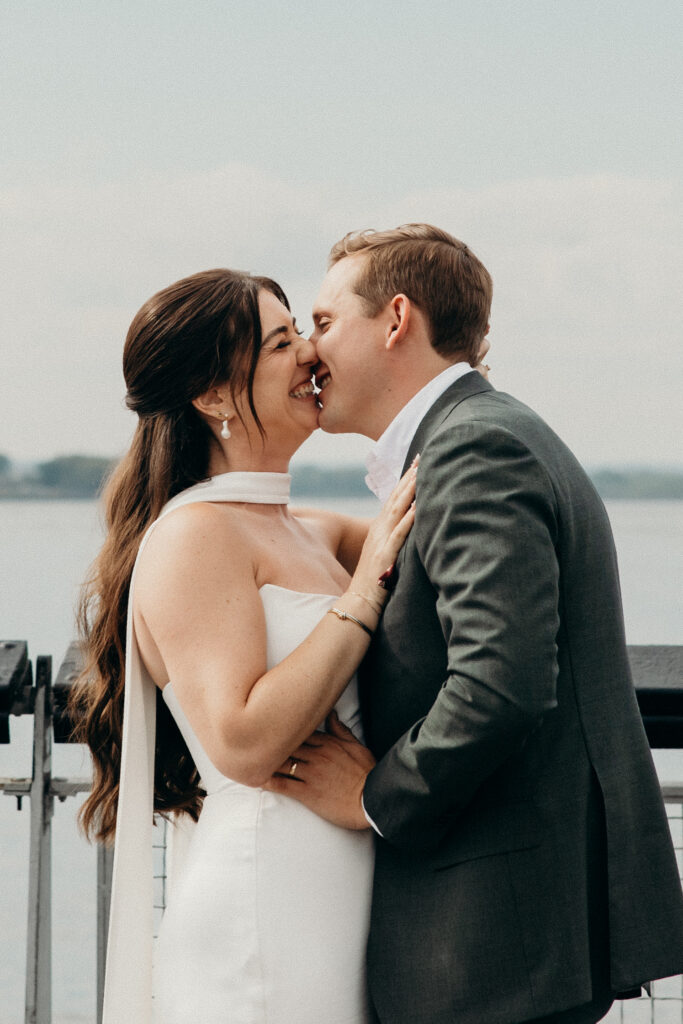 NYC couple share their first kiss during their Red Hook elopement ceremony in Brooklyn