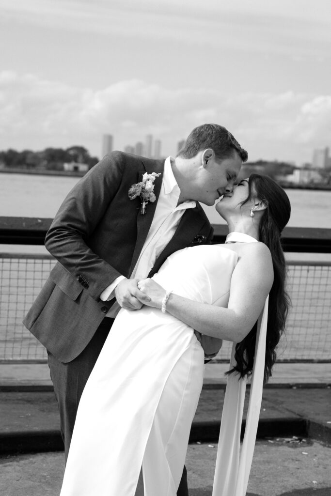 NYC couple share their first kiss during their Red Hook elopement ceremony in Brooklyn
