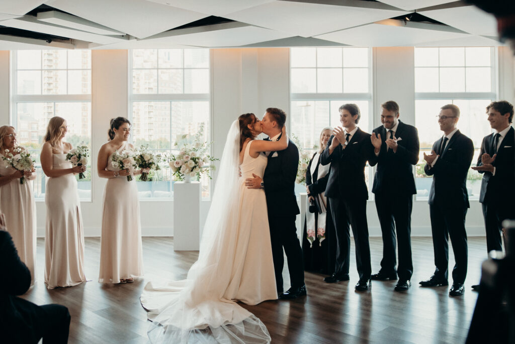 Bride and groom first kiss during the wedding ceremony at Maritime Parc