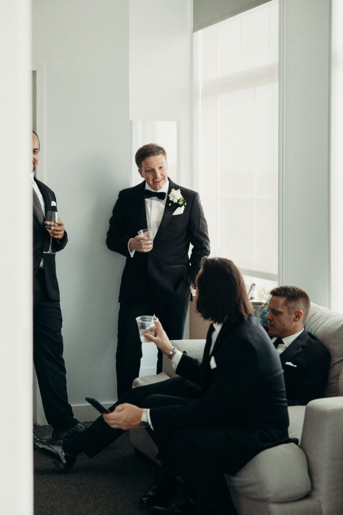 Groom interacts with the groomsmen at a Maritime Parc wedding