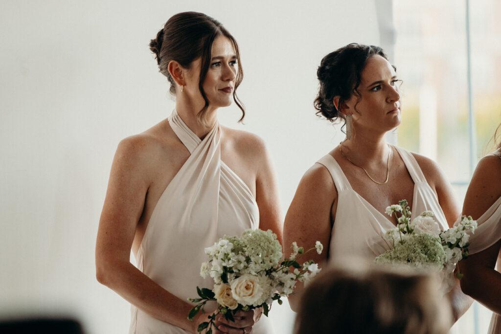 Bridesmaids line up during the wedding ceremony at Maritime Parc