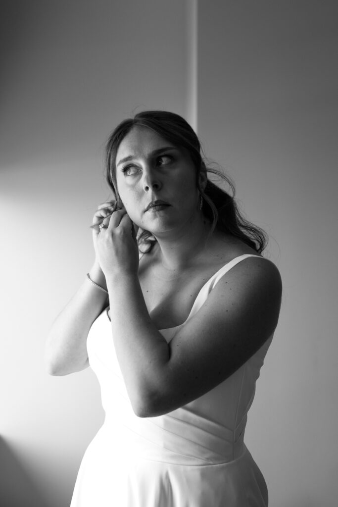 Bride wears earrings at Maritime Parc