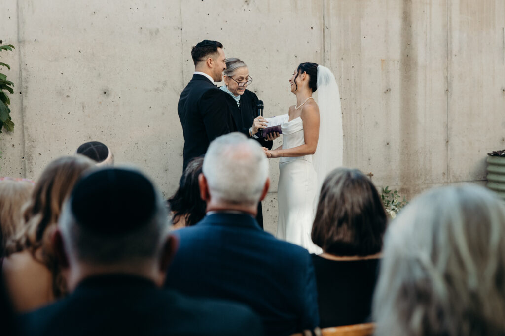 Couple holding hands at the Radio Star wedding