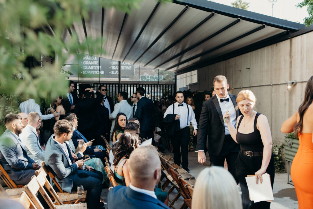 Wedding guests gather during the wedding ceremony at the Radio Star