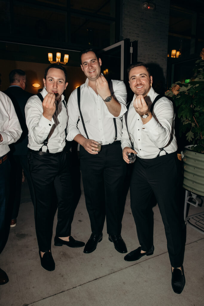 Groomsmen posing at the Radio Star wedding reception