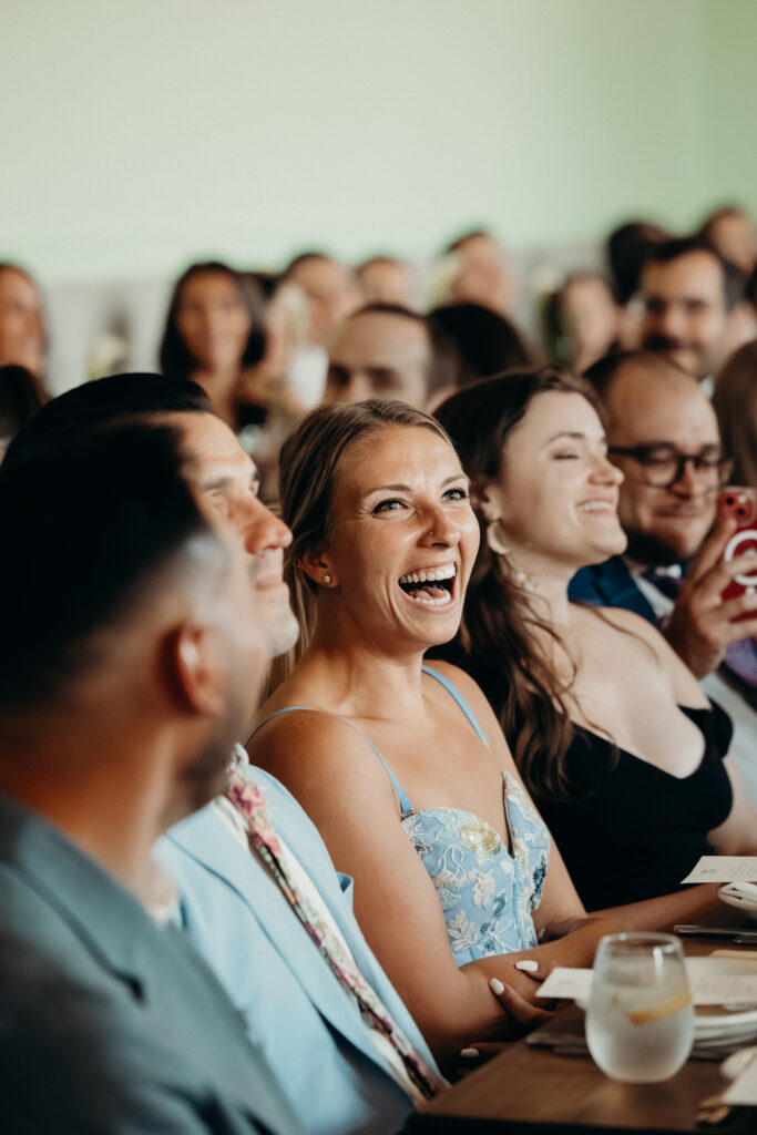 Wedding guest laughing at the Radio Star wedding reception
