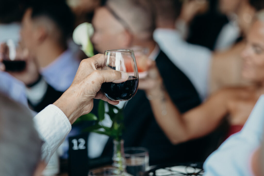 Wedding guests give a toast at the Radio Star wedding reception