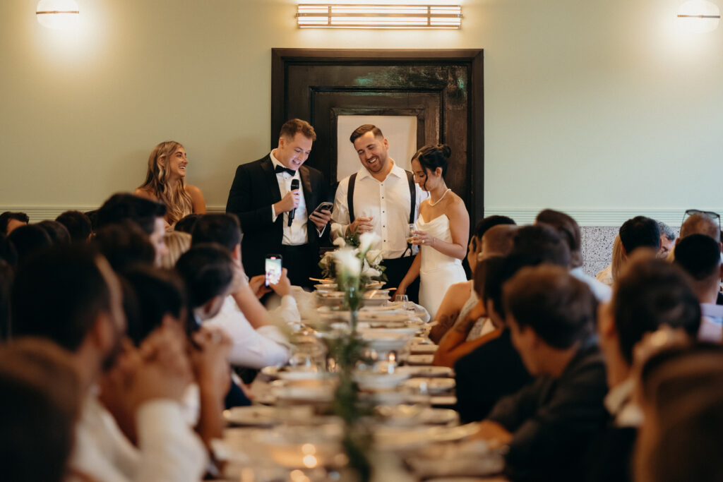 Groomsman giving a speech at the Radio Star wedding reception