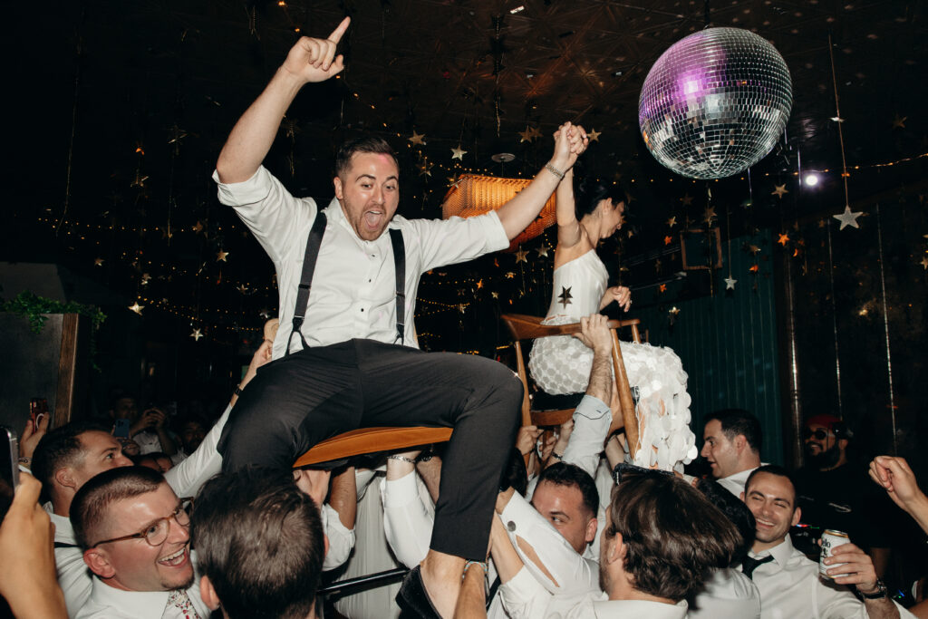 Groom dancing at the Broken Land wedding after-party