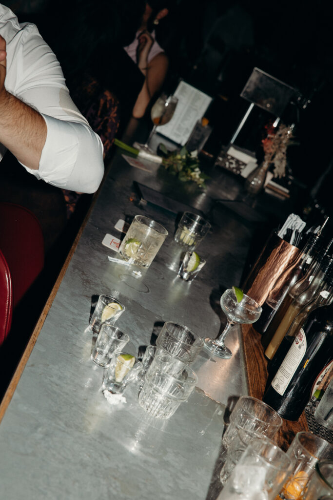 Wedding guests drinking at the Broken Land wedding after-party