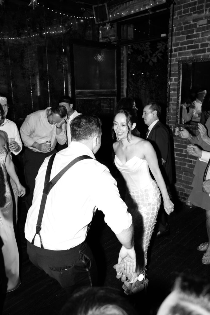 Couple dancing at the Broken Land wedding after-party