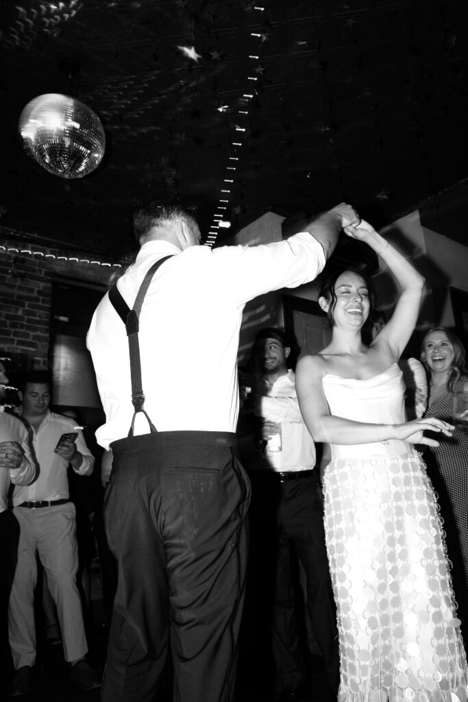 Couple dancing at the Broken Land wedding after-party