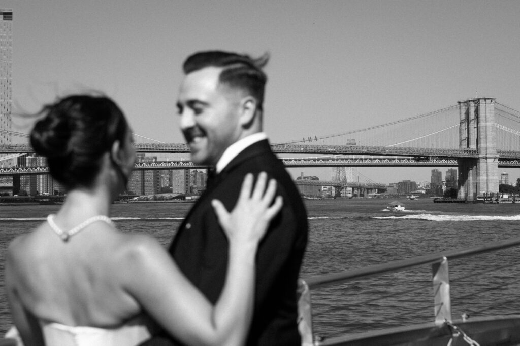 Couple riding a ferry from Seaport to Greenpoint for their Radio Star wedding
