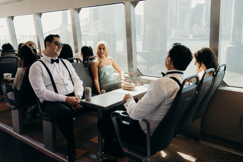 Couple and guests riding a ferry from Seaport to Greenpoint for their Radio Star wedding