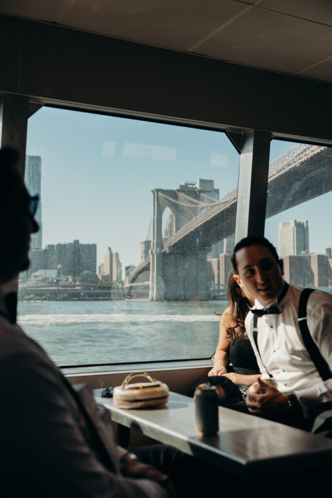 Couple and guests riding a ferry from Seaport to Greenpoint for their Radio Star wedding
