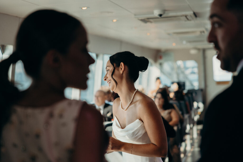 Couple and guests riding a ferry from Seaport to Greenpoint for their Radio Star wedding