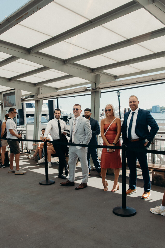 Couple and guests riding a ferry from Seaport to Greenpoint for their Radio Star wedding