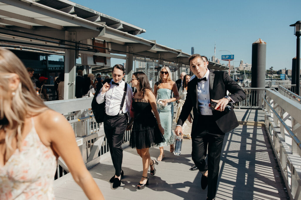 Couple and guests riding a ferry from Seaport to Greenpoint for their Radio Star wedding