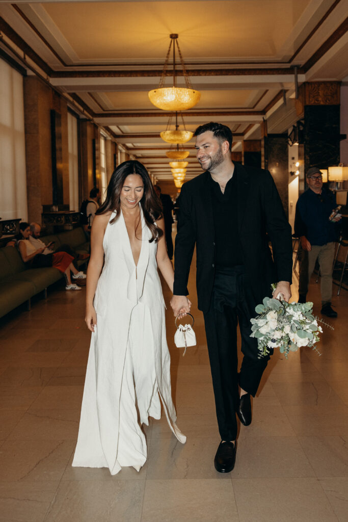 NYC couple on their way to their elopement ceremony at NYC City Hall