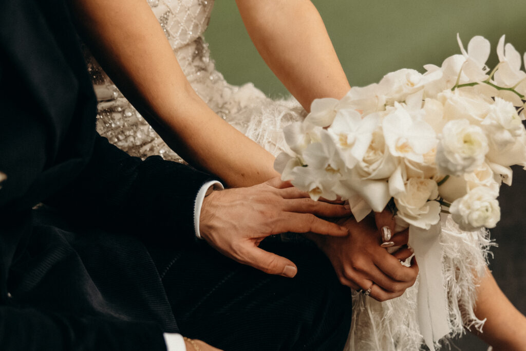 NYC couple holding hands during elopement at NYC City Hall