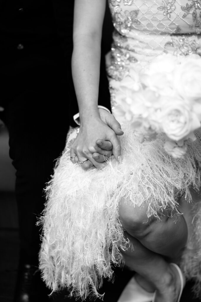 NYC couple holding hands during elopement at NYC City Hall