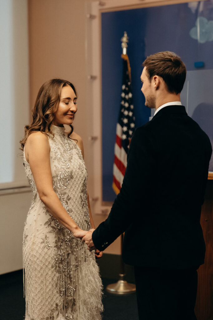 NYC couple exchanging vows during elopement ceremony at NYC City Hall