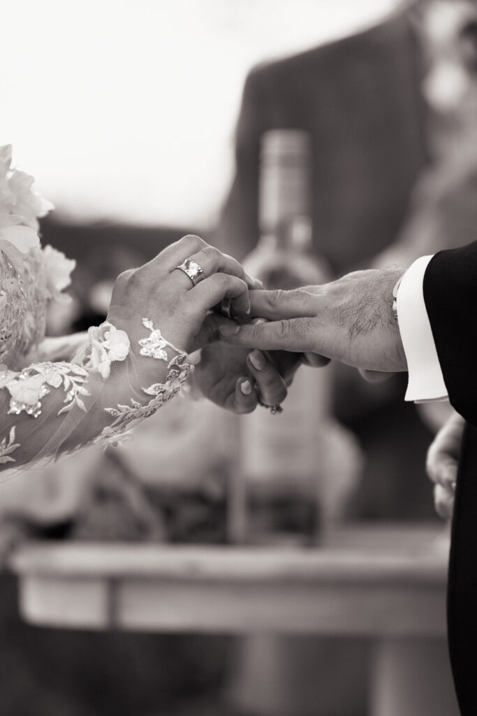 New York couple exchanging rings at Sea Cliff Manor wedding ceremony