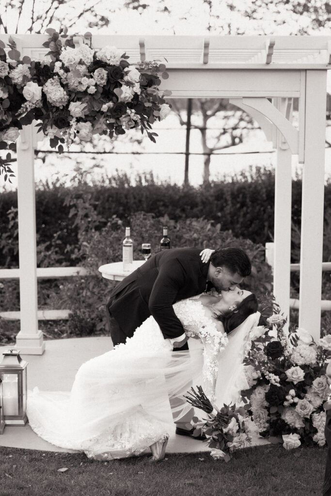 New York couple first kiss at Sea Cliff Manor wedding ceremony