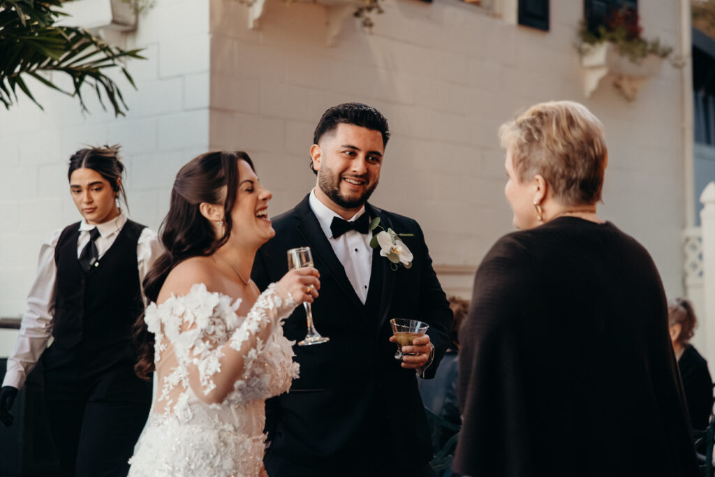 New York couple interacting with guests at Sea Cliff Manor cocktail hour