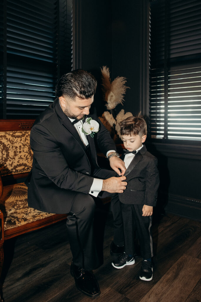 Groom and son getting ready at Sea Cliff Manor