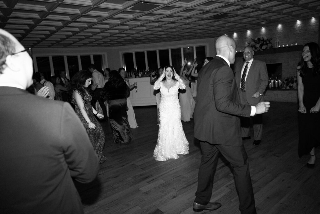 New York bride and guests dancing at Sea Cliff Manor wedding reception