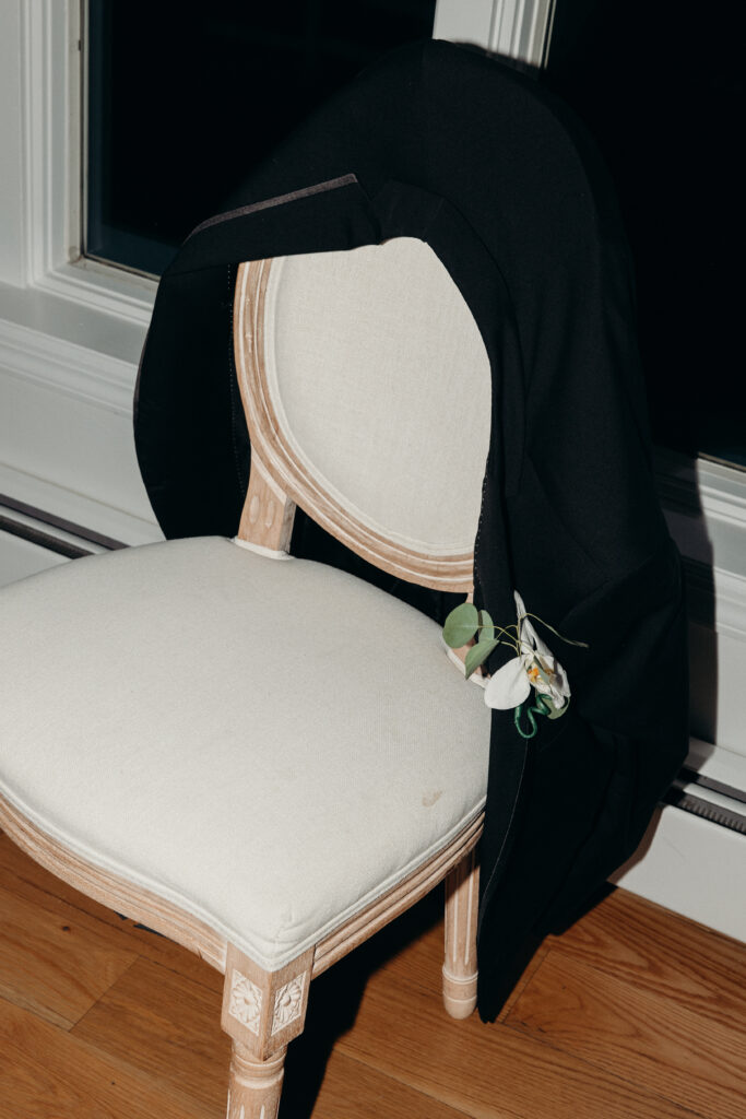Groom suit left on chair at Sea Cliff Manor wedding reception