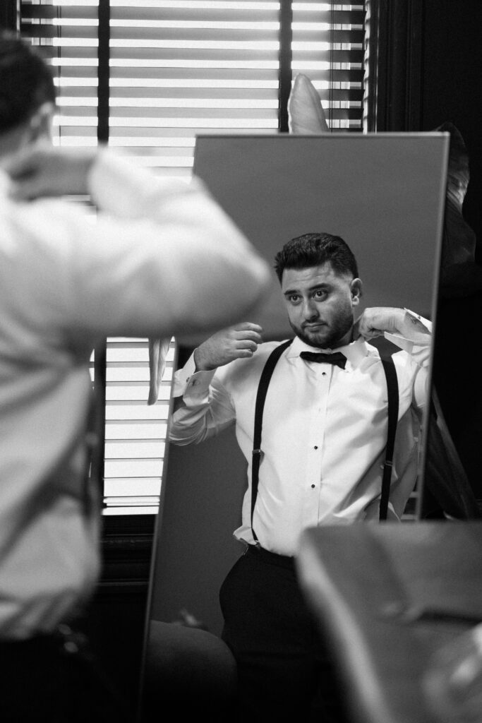 Groom getting ready at Sea Cliff Manor 