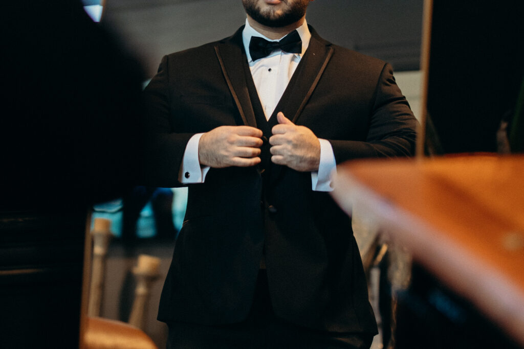 Groom getting ready at Sea Cliff Manor 