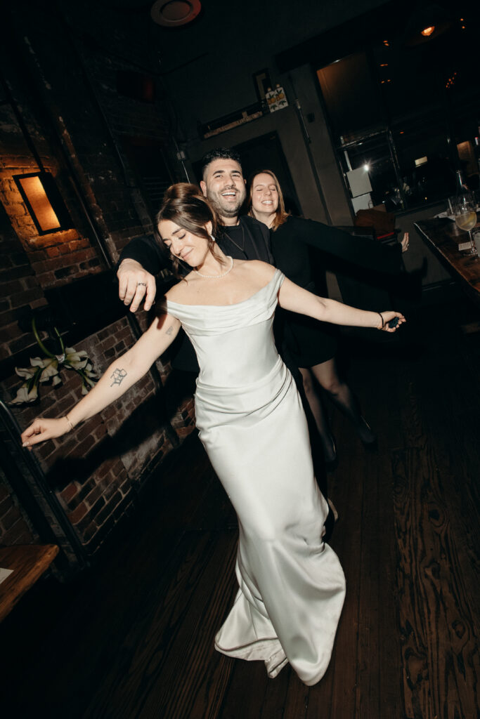 Bride and guests dancing at the wedding celebration at Aurora Williamsburg