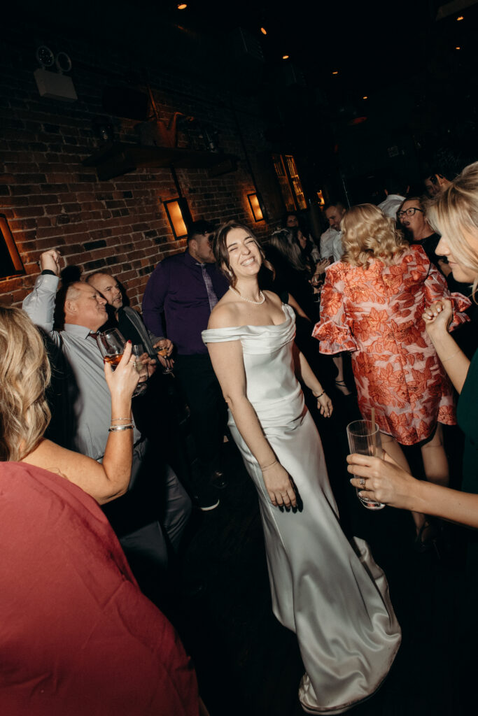 Bride dancing at the wedding celebration at Aurora Williamsburg