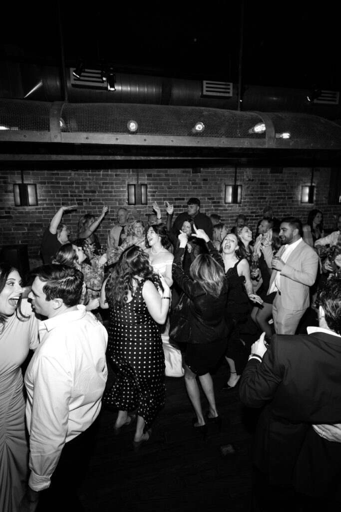 Couple and guests dancing at the wedding celebration at Aurora Williamsburg