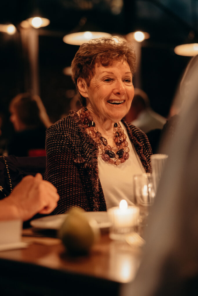 People interacting during dinner at the wedding celebration at Aurora Williamsburg