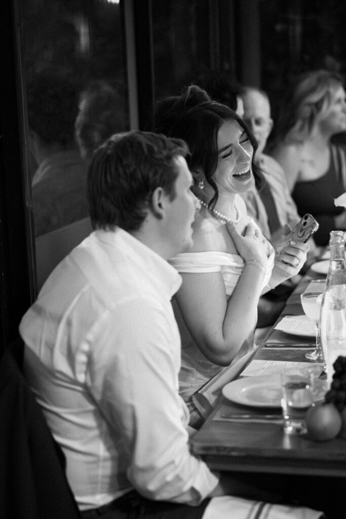 New York couple interacting with guests during dinner at their wedding celebration at Aurora Williamsburg