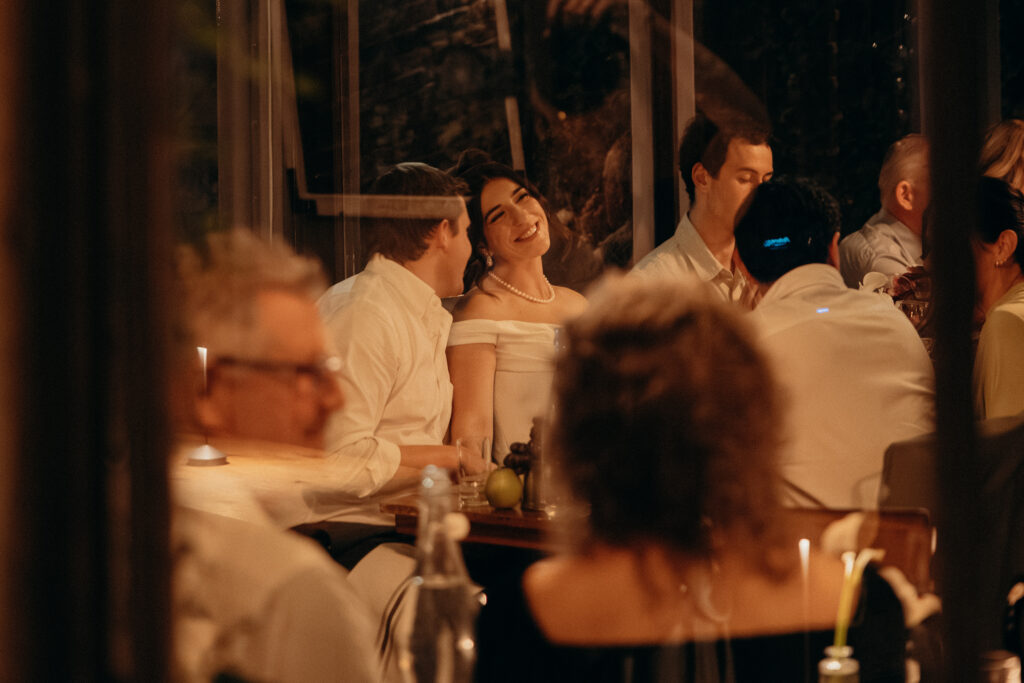 New York couple interacting with guests during dinner at their wedding celebration at Aurora Williamsburg