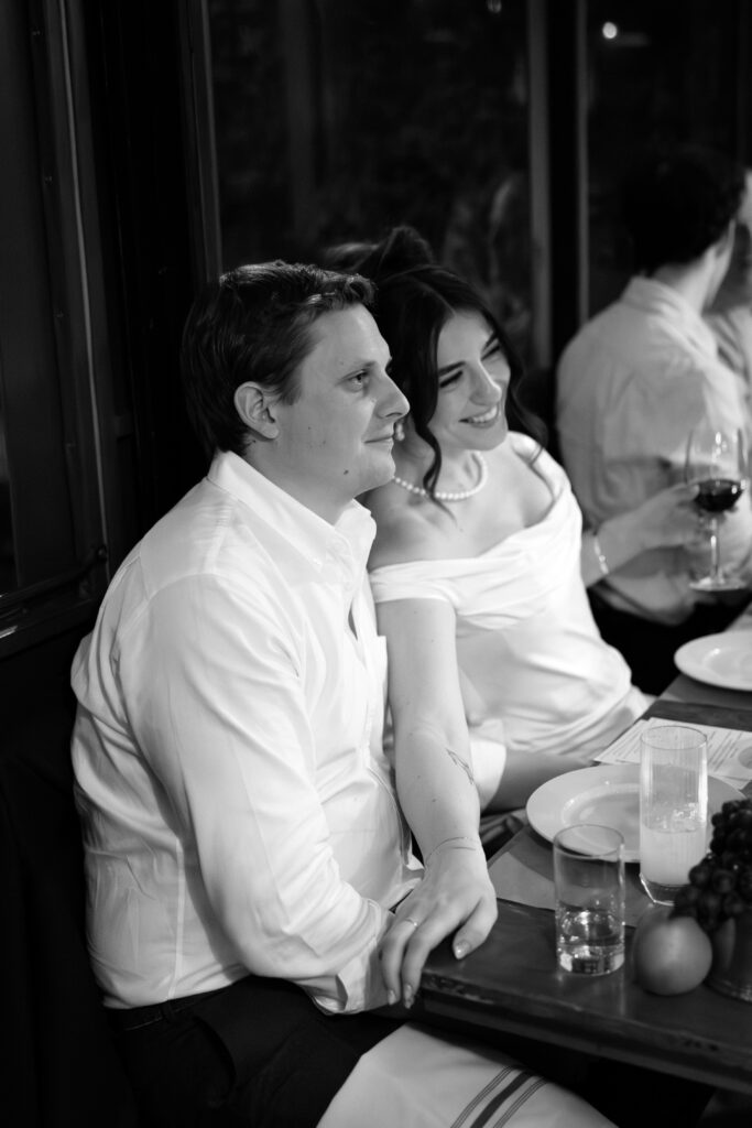New York couple interacting with guests during dinner at their wedding celebration at Aurora Williamsburg