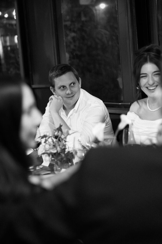 New York couple smiling during dinner at their wedding celebration at Aurora Williamsburg