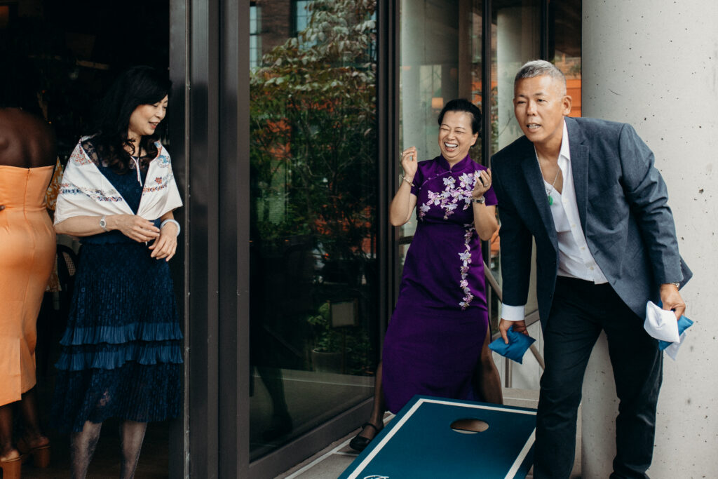 Wedding guests playing games at a Celestine DUMBO wedding reception 